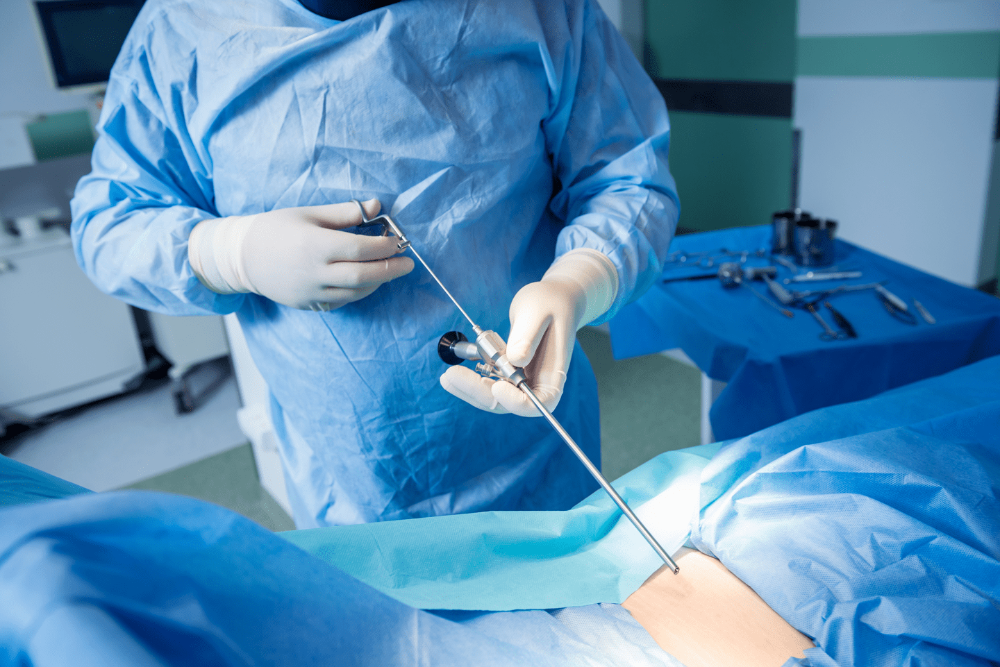 Surgeon performs endoscopic microdiscectomy of herniated intervertebral disc