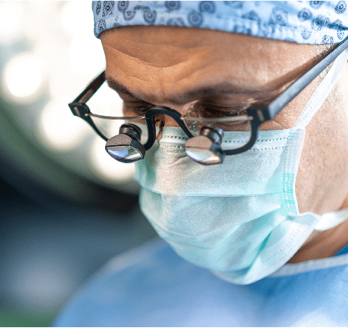 Close up face of surgeon man looking away with protective mask.
