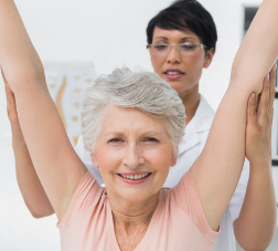 Elderly woman stretching her arms