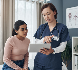 Female nurse talking to patient