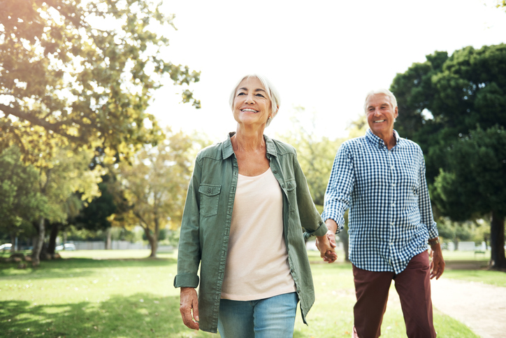older couple walking outside