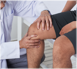 physician examining a knee