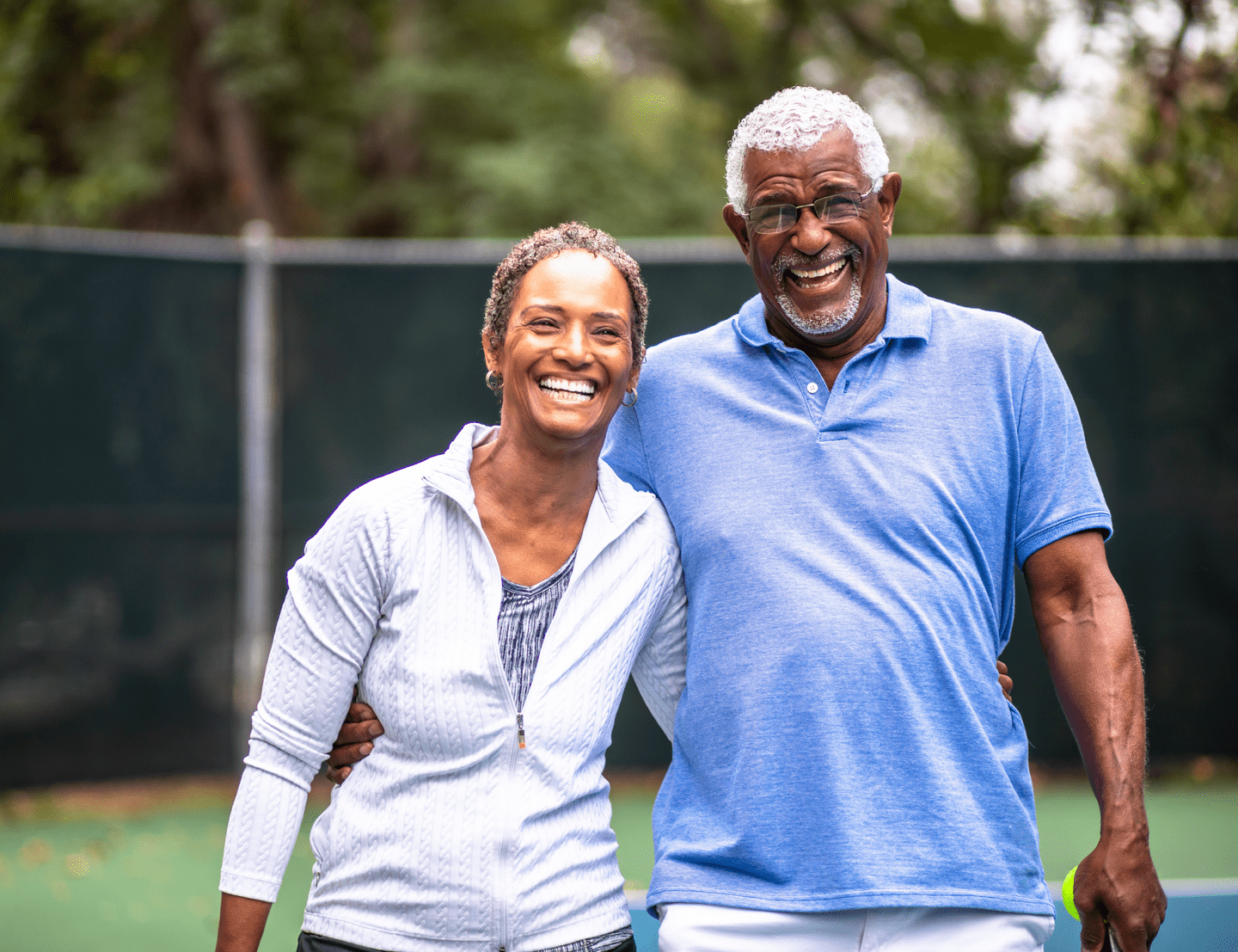 Portrait of a senior black man with a tennis racket