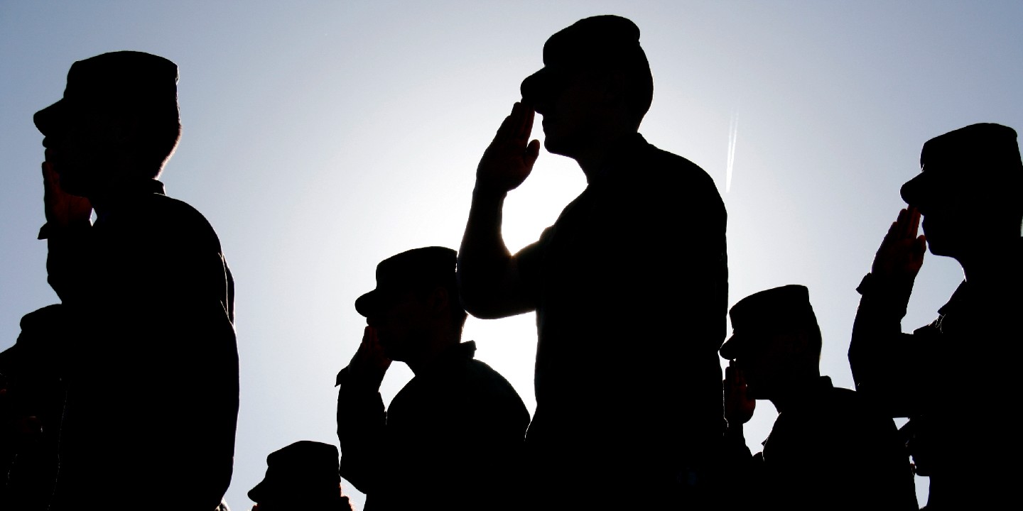Soldiers Salute the Flag at Sunset Ortho Tricare Prime