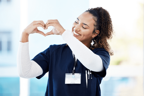 Smile, happy or nurse and love gesture in healthcare