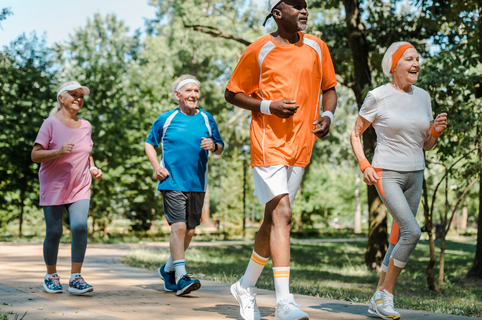 a group of older men and women jogging