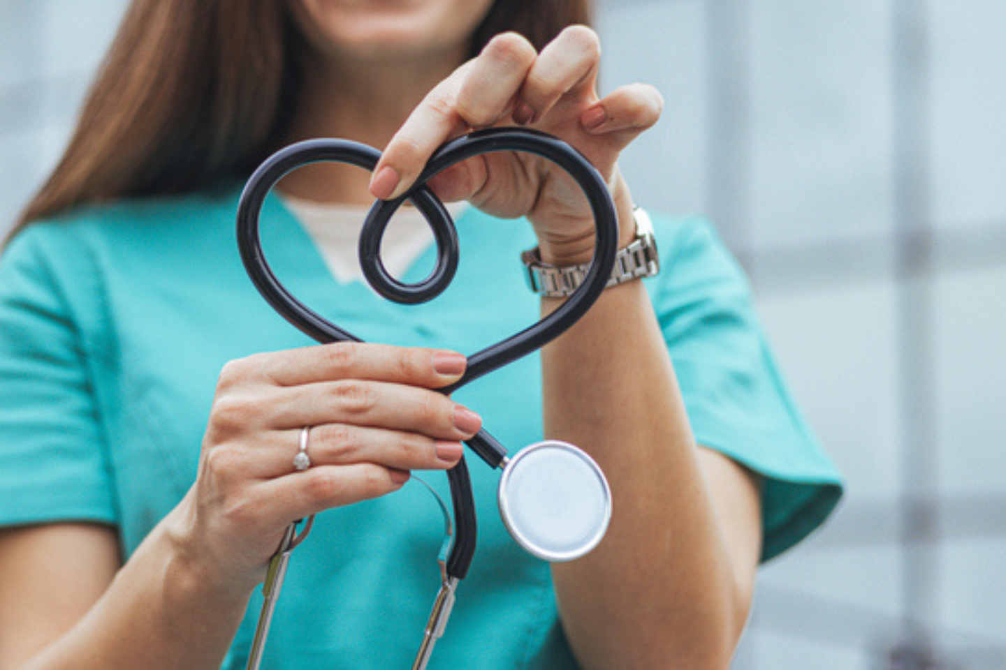 Nurse holding up a a heart