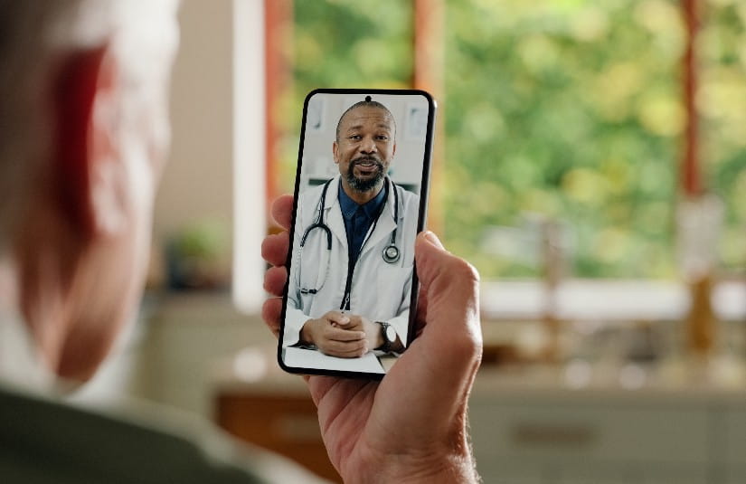 Primary Care Man, cellphone screen and telehealth with doctor