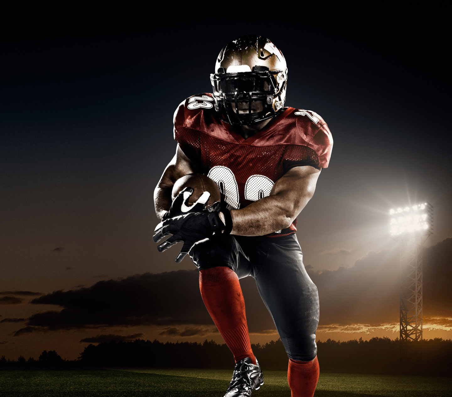 A male american football player makes a dramatic play. The panoramic view of stadium is behind him. The sky is dark and cloudy behind him. The player is wearing generic unbranded american football uniform. The stadium is 3D rendered.