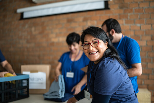 volunteer working in a community charity donation center