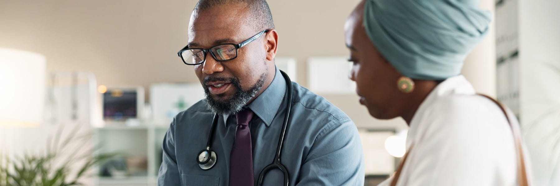 Tablet, conversation and black woman with doctor in hospital for medical diagnosis or wellness advice. Discussion, digital techno