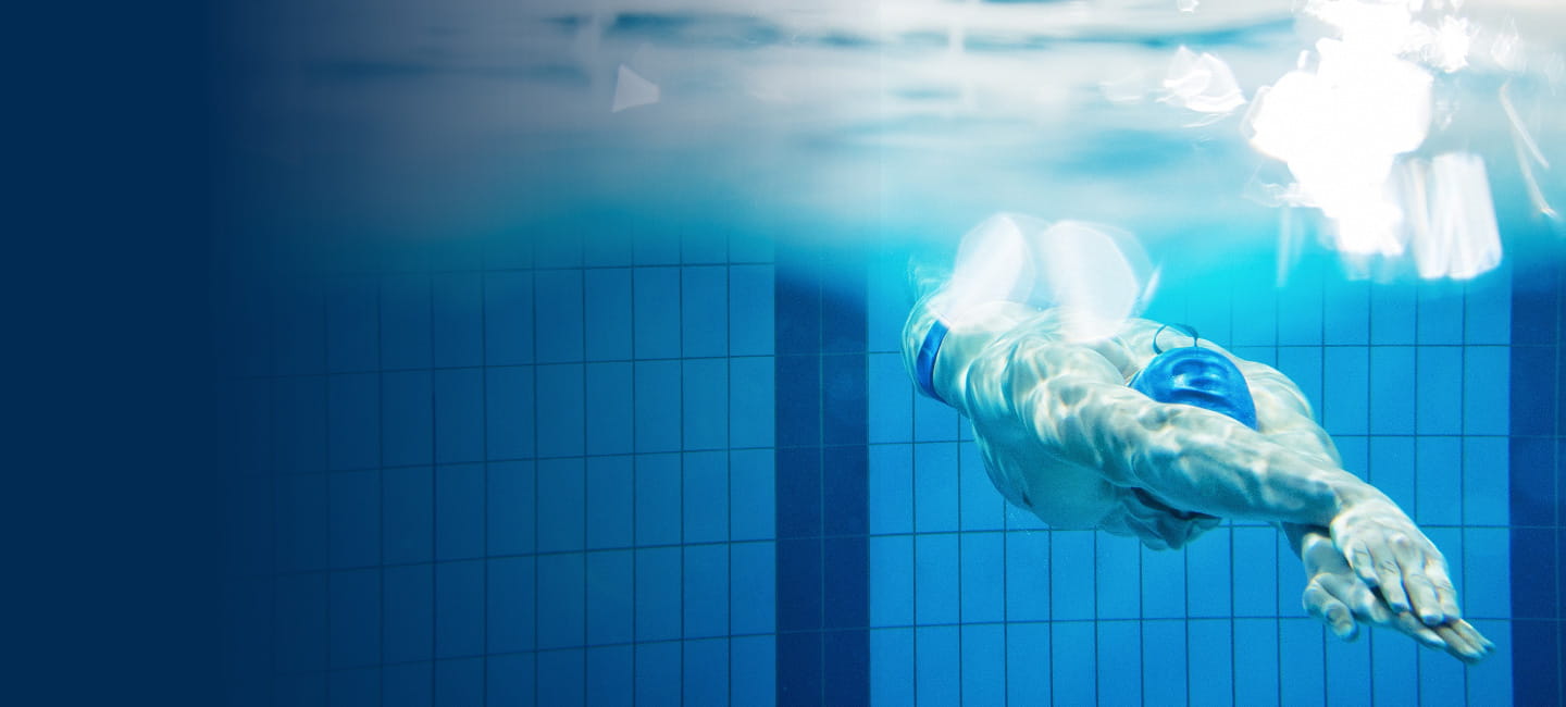 swimmer diving in the pool