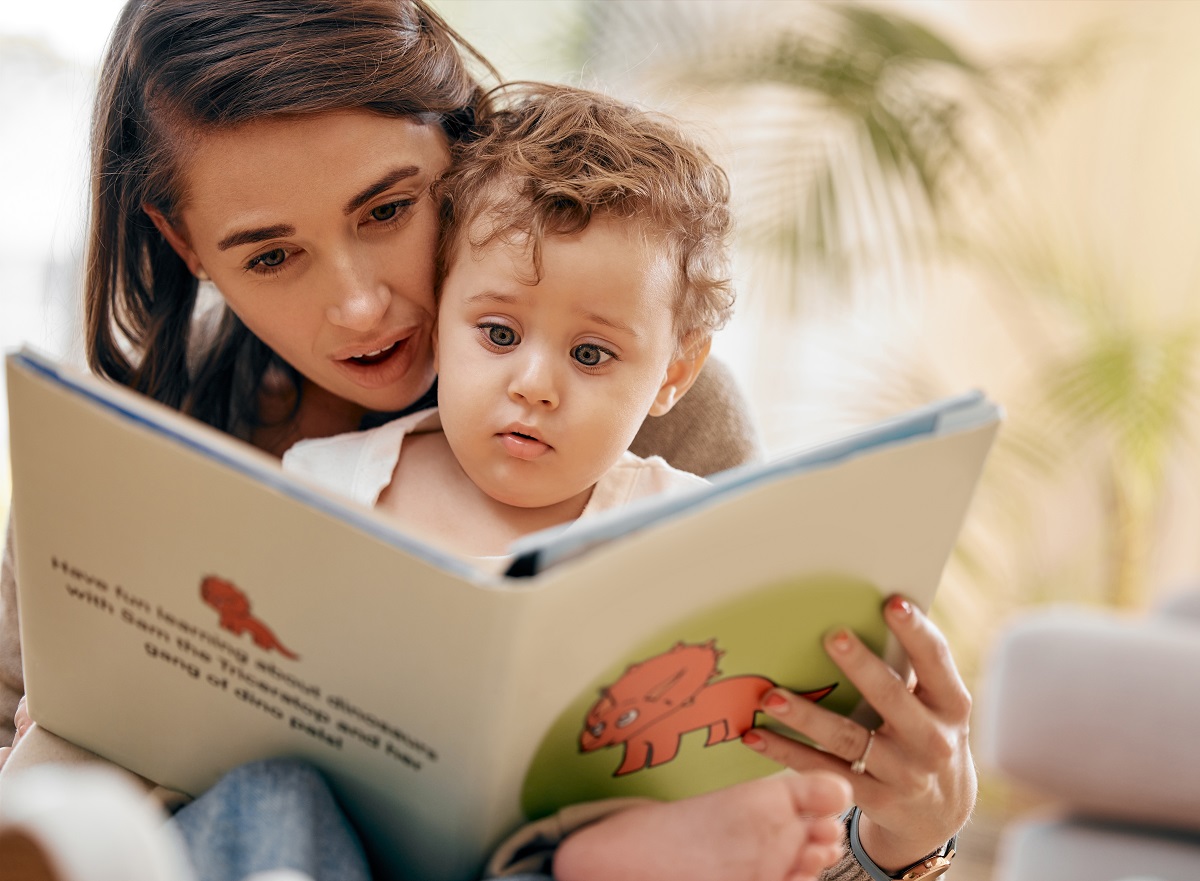 mother with young child reading book