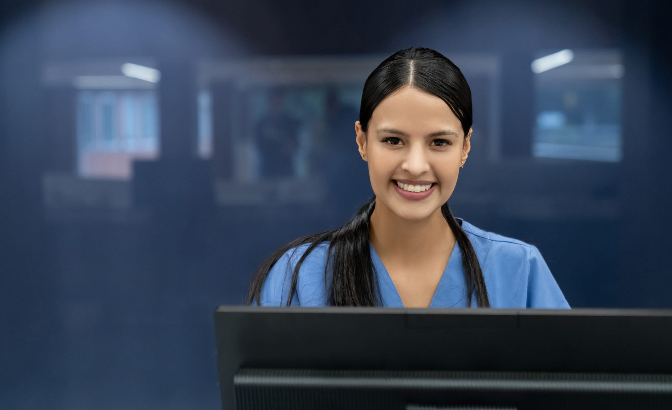 Medical professional at a computer