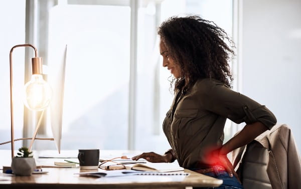 Shot of a businesswoman suffering from back pain