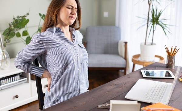 Woman suffering with back pain