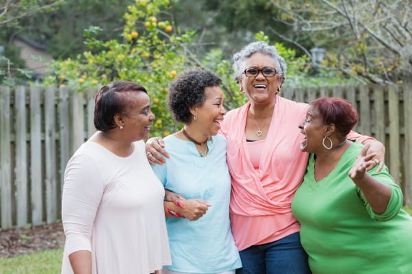 Four African-American women standing outdoors together