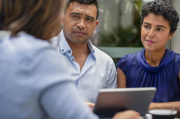 Concerned couple talking to provider