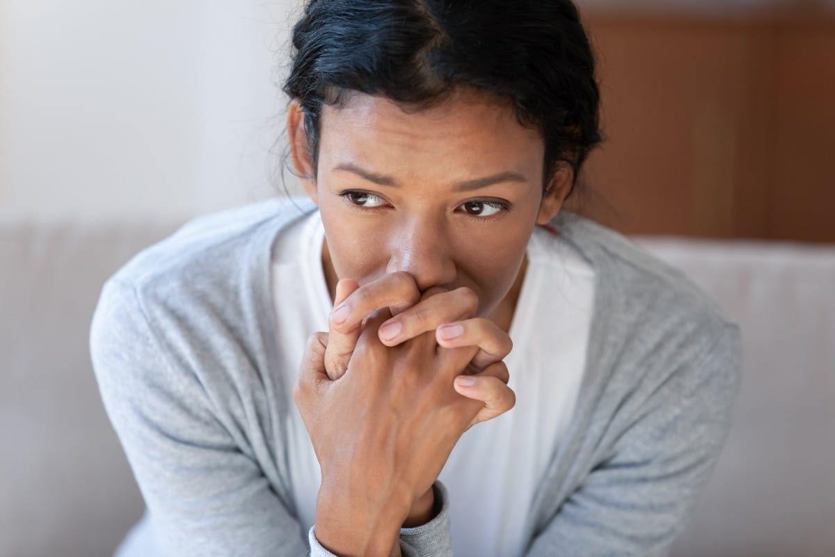 Pensive African American young woman look in distance thinking 