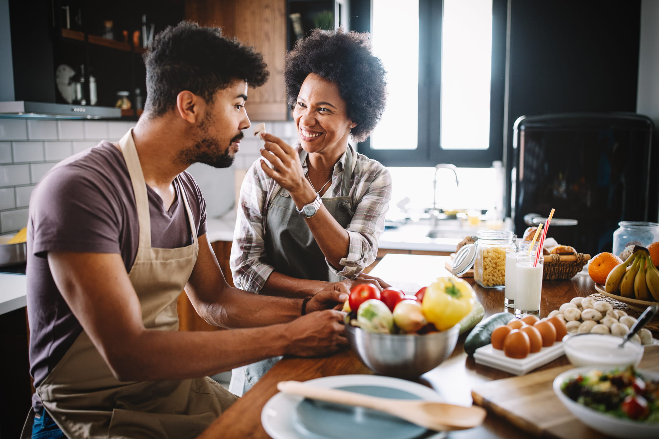 Couple doing date night at home with dinner