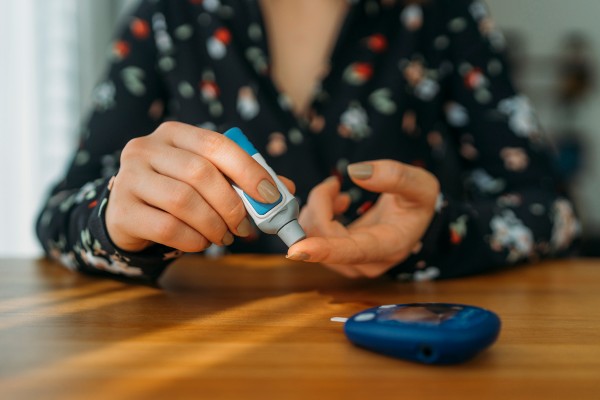 Diabetic checking blood sugar