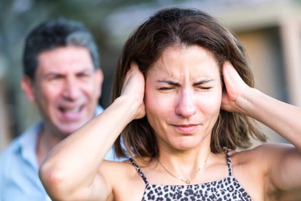 two adults fighting