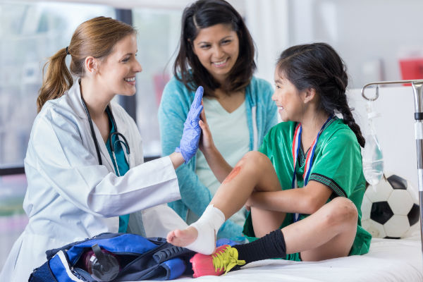 Kid in an ER with her mom and a woman doctor