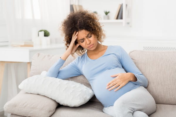 young pregnant woman in  pain
