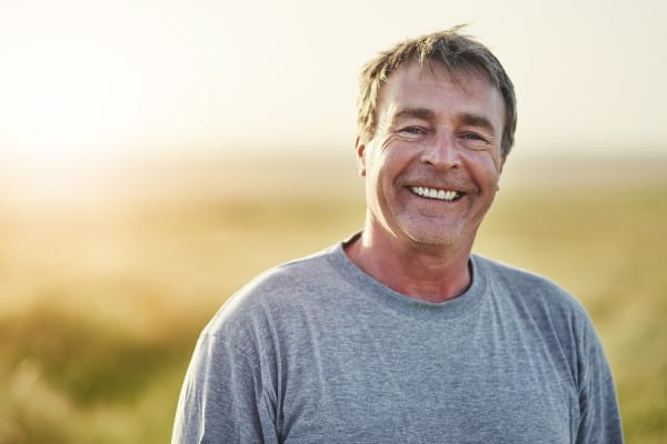 Older man smiling at the camera