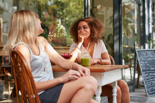 Two young girls chatting