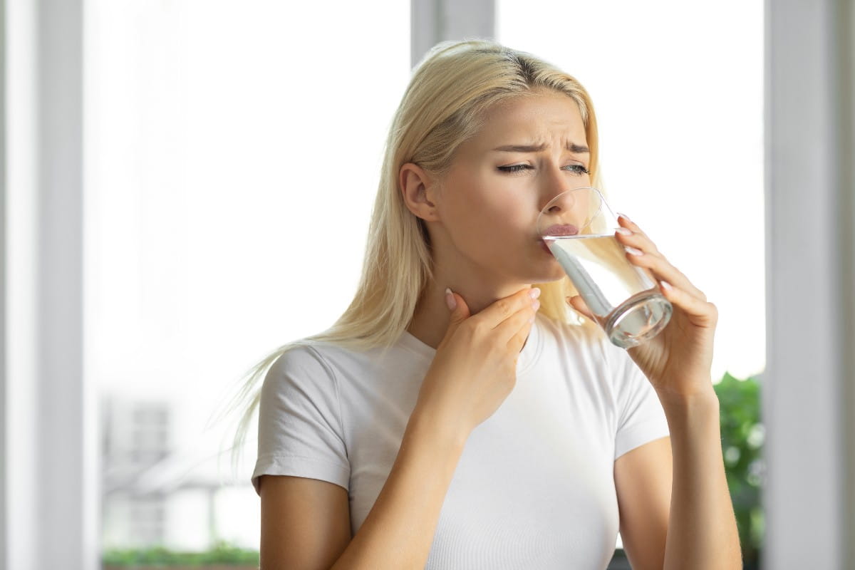 Young woman drinking water