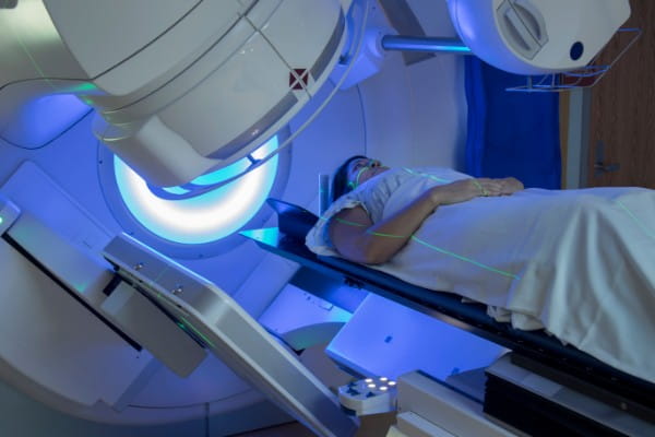 Woman Receiving Radiation Therapy Treatments for cancer