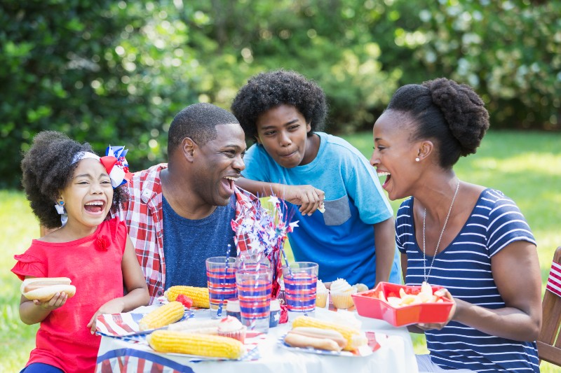 A family enjoying a backyard cookout on Memorial Day