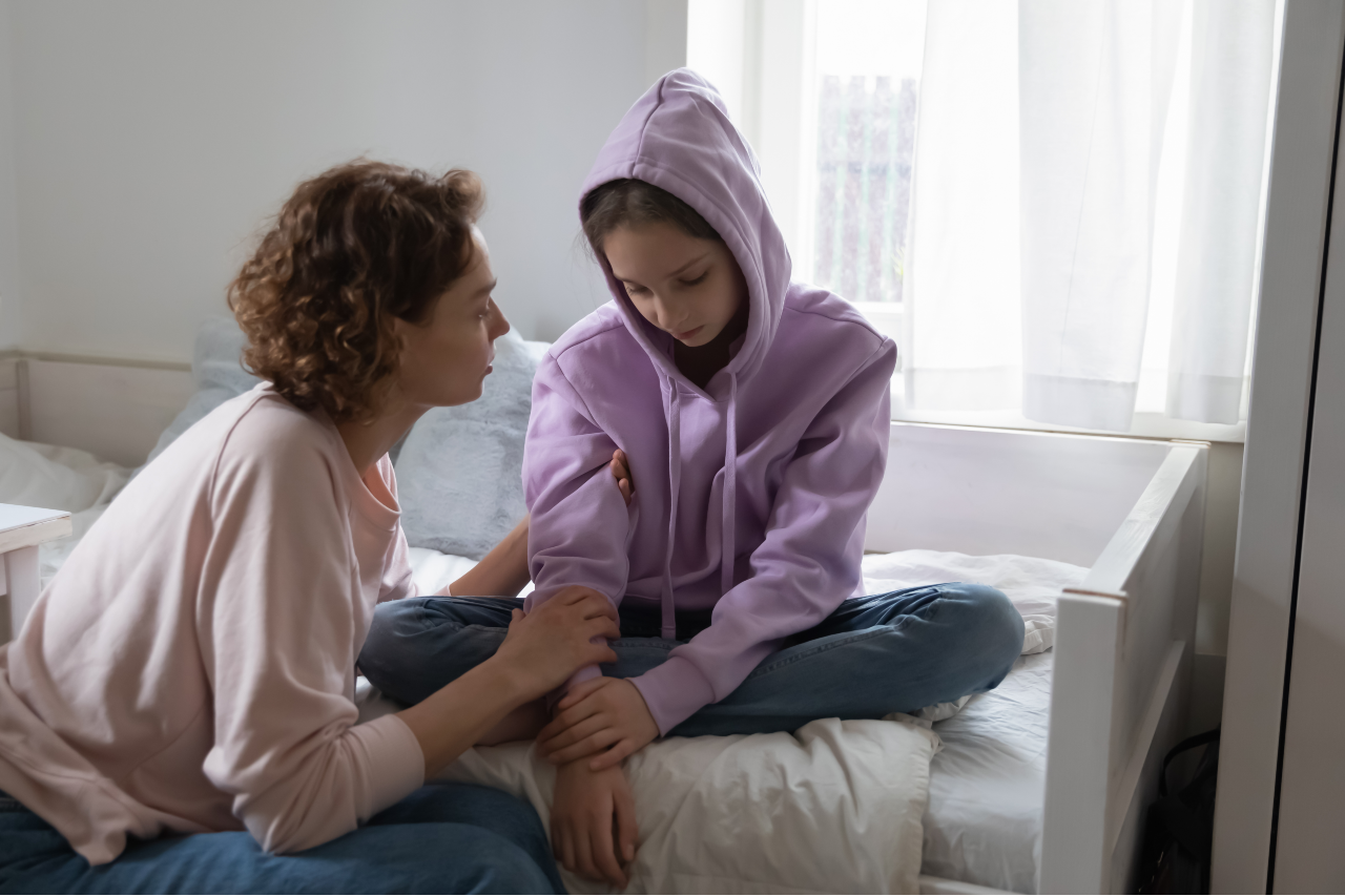 Affectionate young mom supporting stressed sad teen child daughter