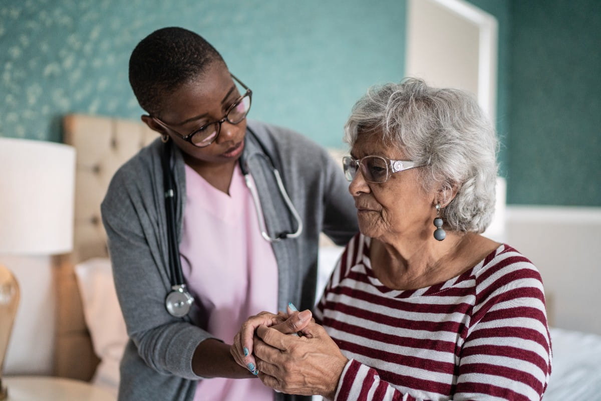 Nurse helping a women