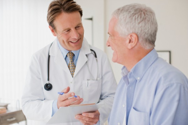 Doctor talking with patient in doctors office