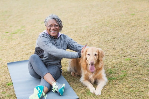 Women exercising with dog