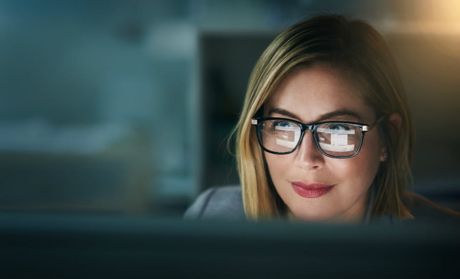 woman looking at computer screen