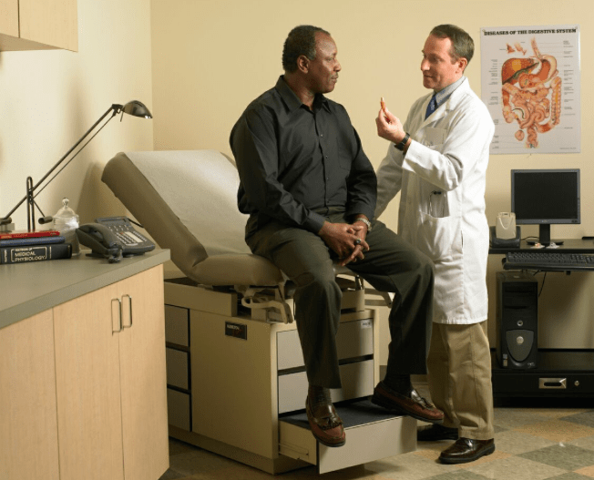 Doctor explains pill cam to patient